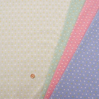 Cotton bonded reversible knit fabric with dots